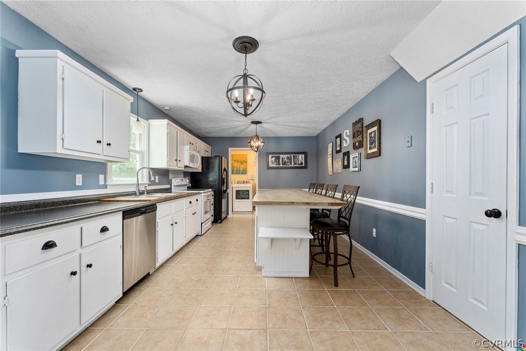 13571 Bailey Bridge Road Midlothian, VA 23112 - Photo 15 of 46 a kitchen with sink cabinets and window