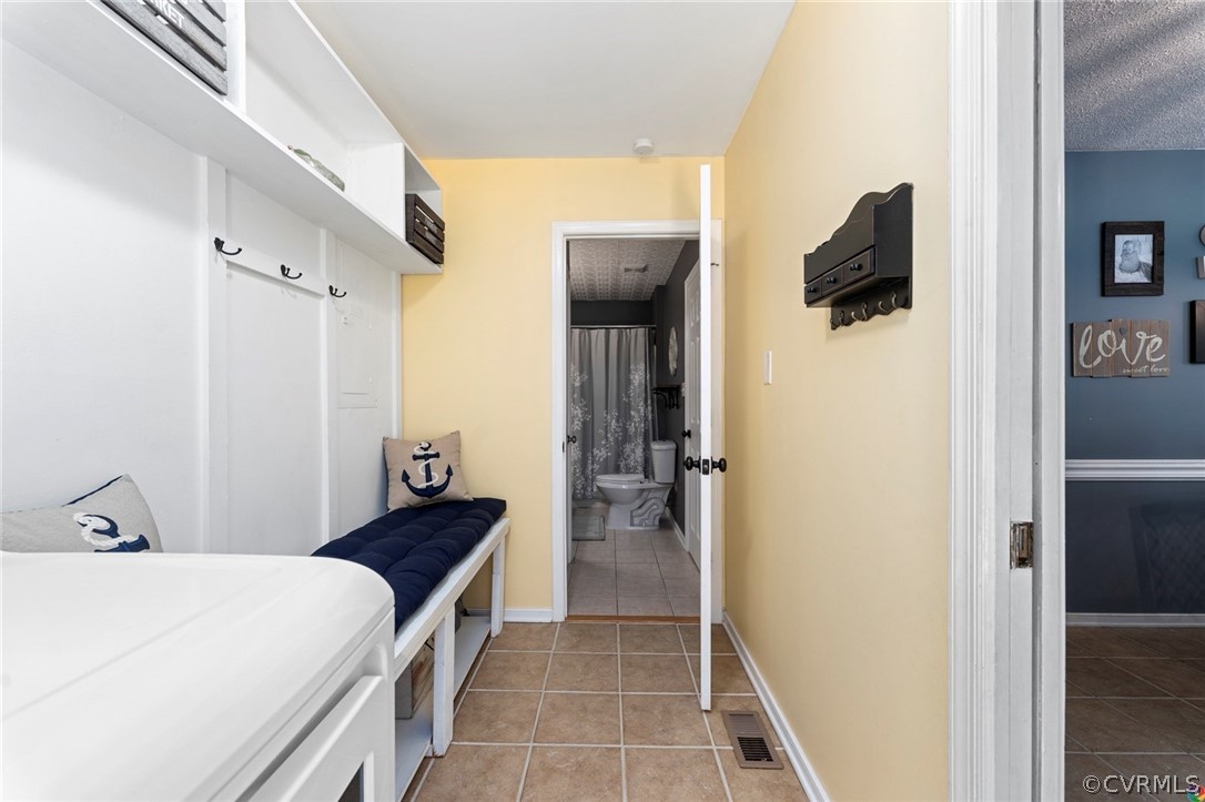 13571 Bailey Bridge Road Midlothian, VA 23112 - Photo 20 of 46 a room with a bed and a refrigerator