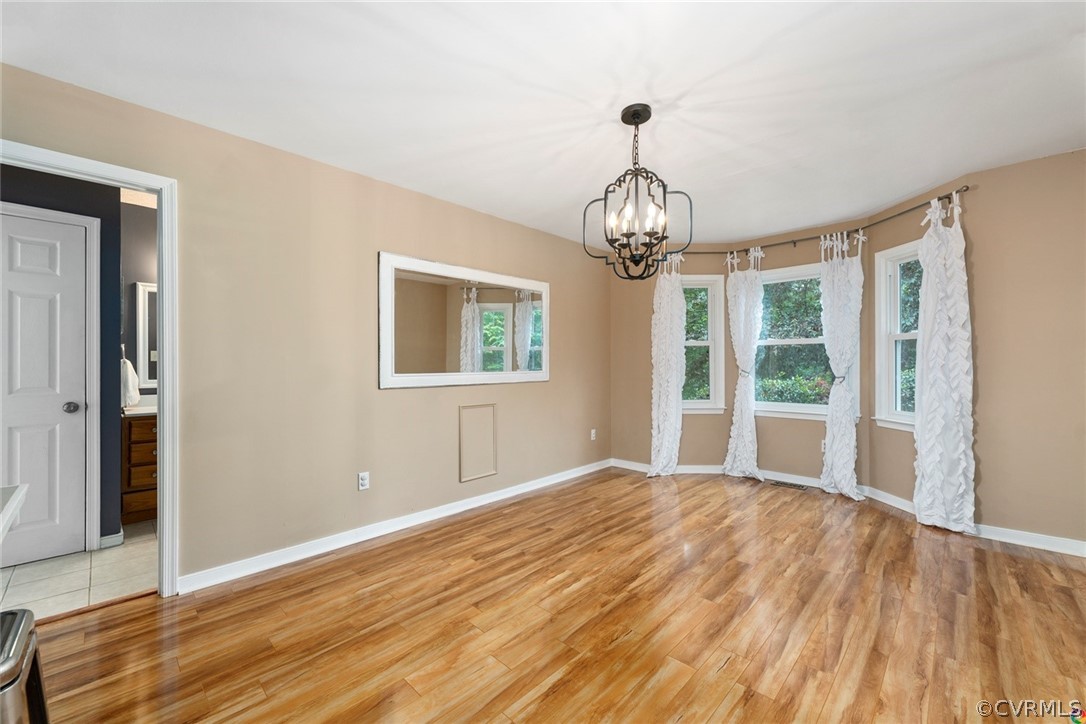 13571 Bailey Bridge Road Midlothian, VA 23112 - Photo 23 of 46 a view of empty room with wooden floor and fan