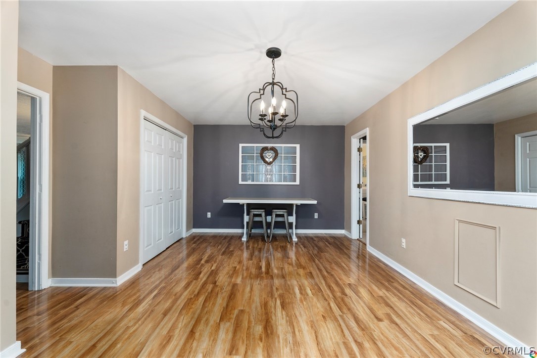 13571 Bailey Bridge Road Midlothian, VA 23112 - Photo 24 of 46 a view of a room with wooden floor lounge chair and windows