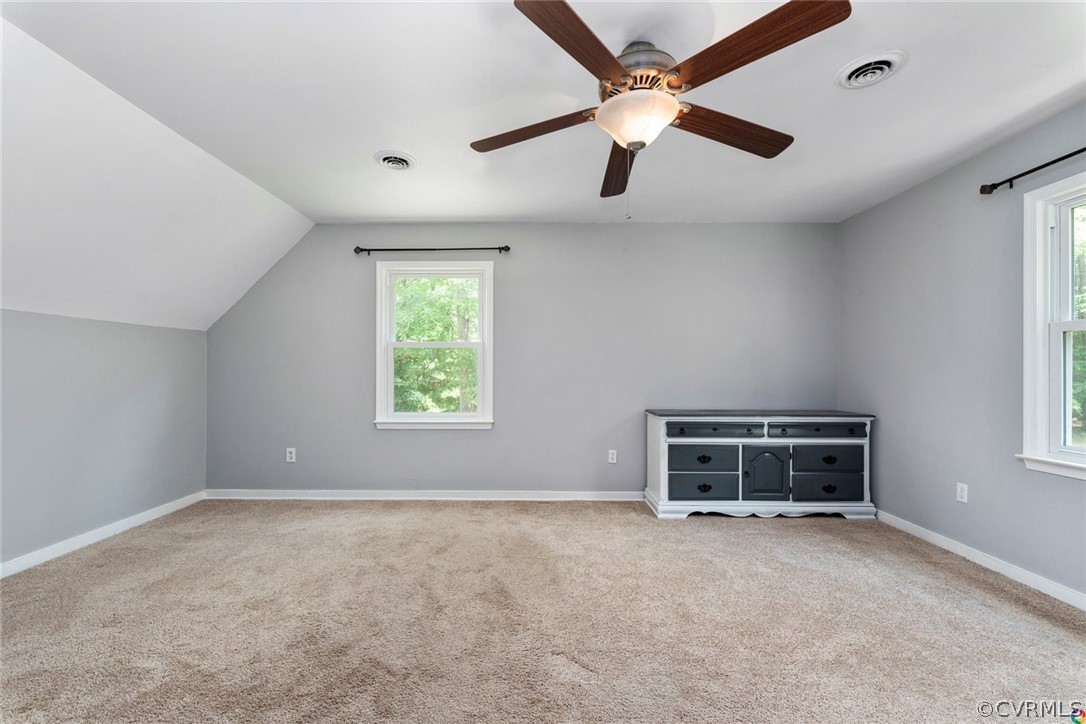 13571 Bailey Bridge Road Midlothian, VA 23112 - Photo 26 of 46 an empty room with windows and ceiling fan