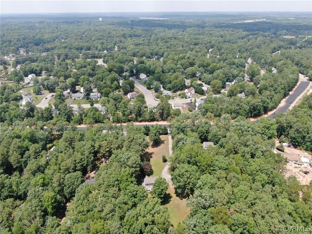 13571 Bailey Bridge Road Midlothian, VA 23112 - Photo 44 of 46 an aerial view of a houses with a lush green hillside