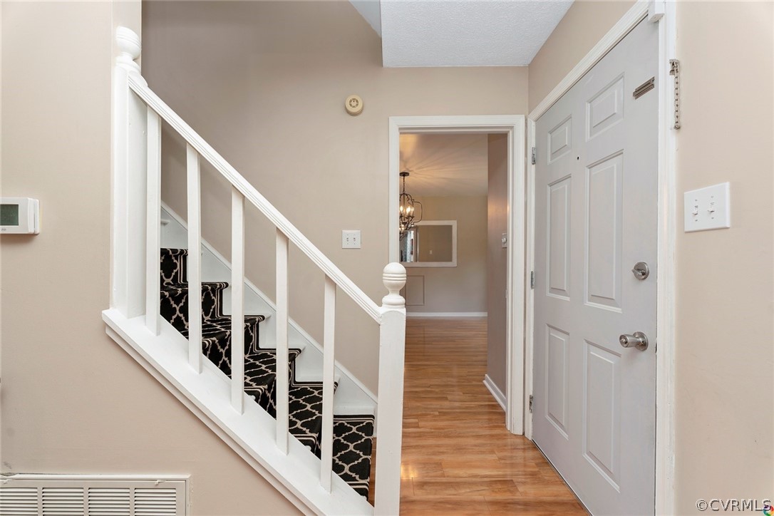 13571 Bailey Bridge Road Midlothian, VA 23112 - Photo 6 of 46 a view of a hallway with wooden floor and entryway