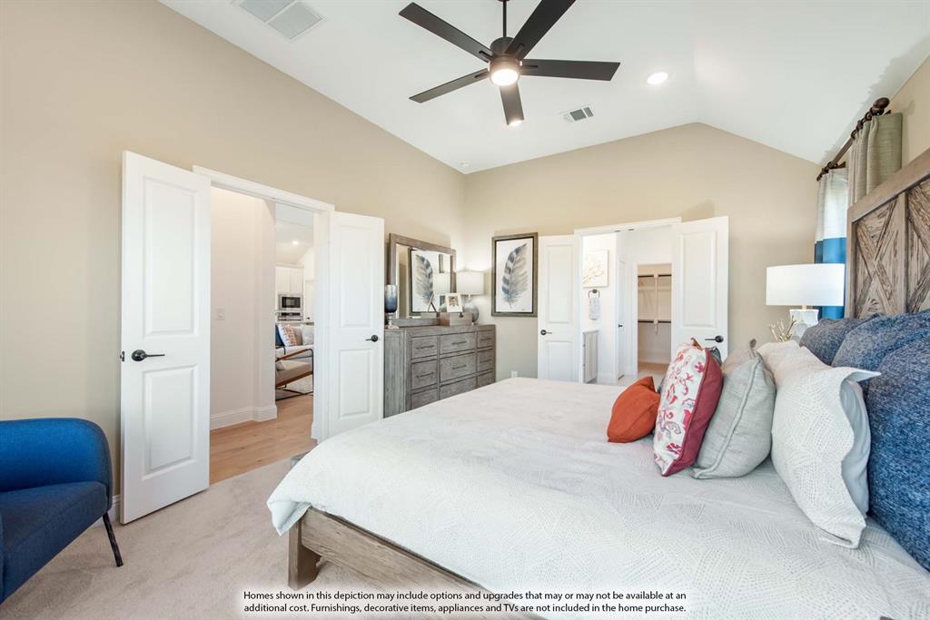 1144 Hitching Post Way Oak Point, TX 75068 - Photo 23 of 39 a spacious bedroom with a bed and a chandelier