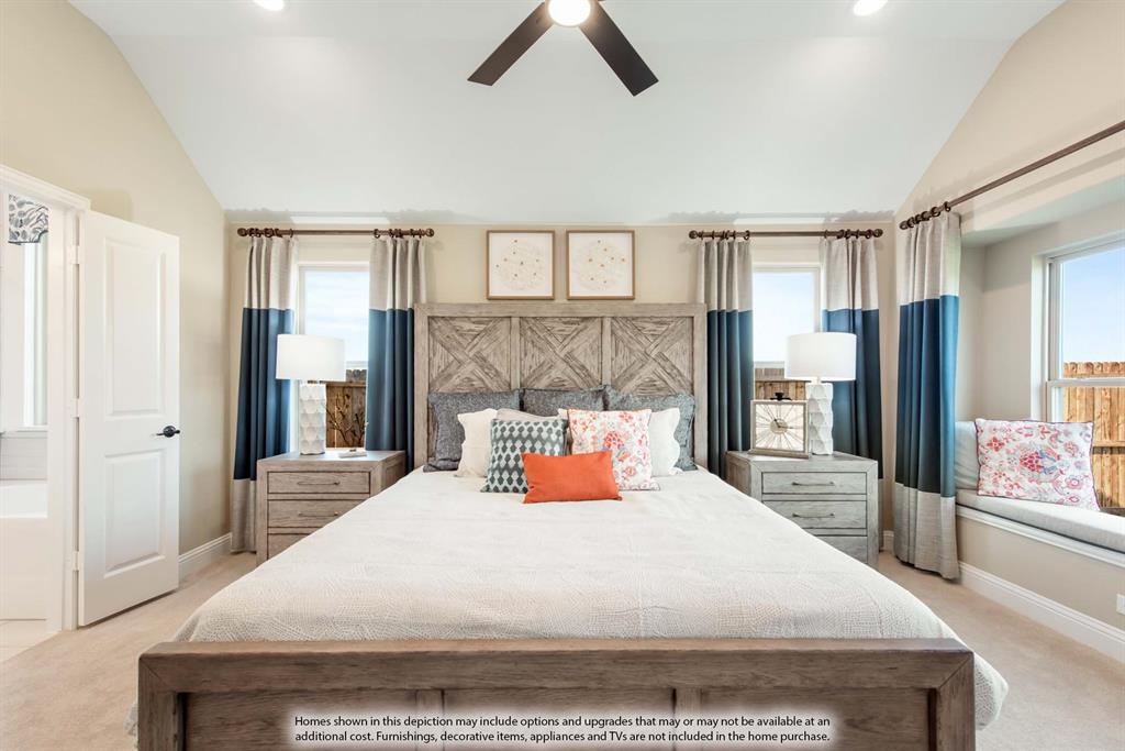 1144 Hitching Post Way Oak Point, TX 75068 - Photo 24 of 39 a bedroom with a large bed and a chandelier