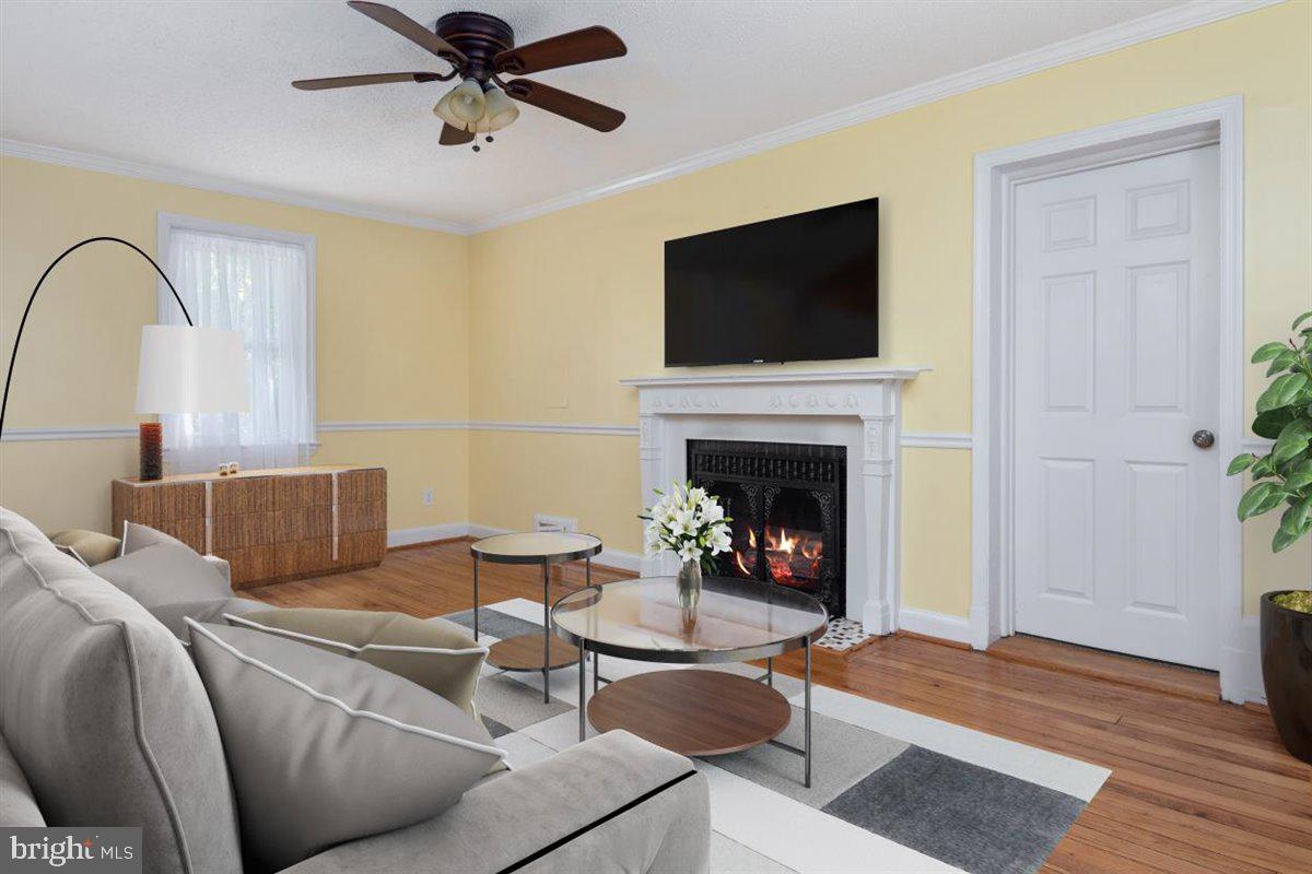 8711 Bradford Road Silver Spring, MD 20901 - Photo 5 of 40 Living Room with Rebuilt Wood-Burning Fireplace