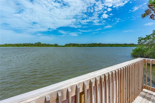 a view of a lake from a balcony