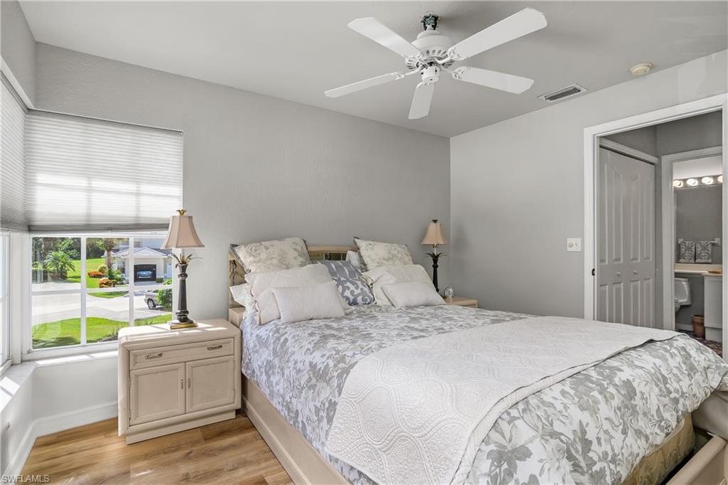 13061 Hamilton Harbour Drive, Unit R1 Naples, FL 34110 - Photo 16 of 23 Bedroom featuring light wood-type flooring and a ceiling fan