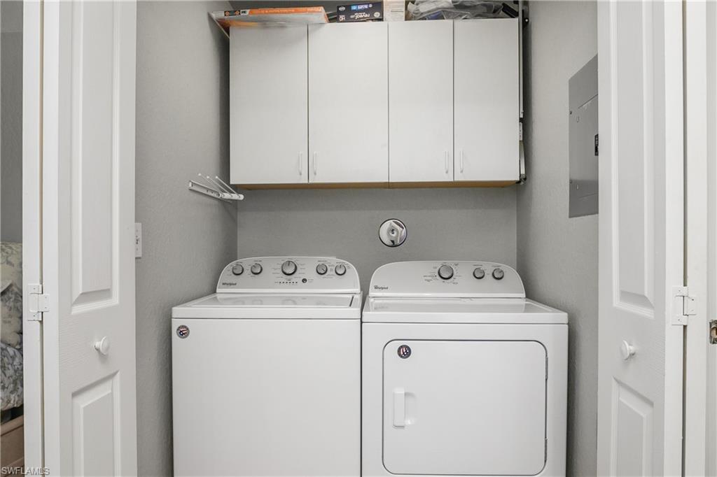 13061 Hamilton Harbour Drive, Unit R1 Naples, FL 34110 - Photo 23 of 23 Laundry room featuring washing machine and clothes dryer and electric panel