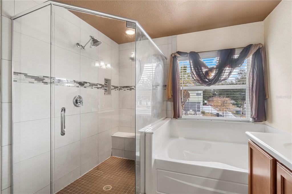 4199 Southwest 46th Court Ocala, FL 34474 - Photo 31 of 50 a bathroom with a bathtub and a shower