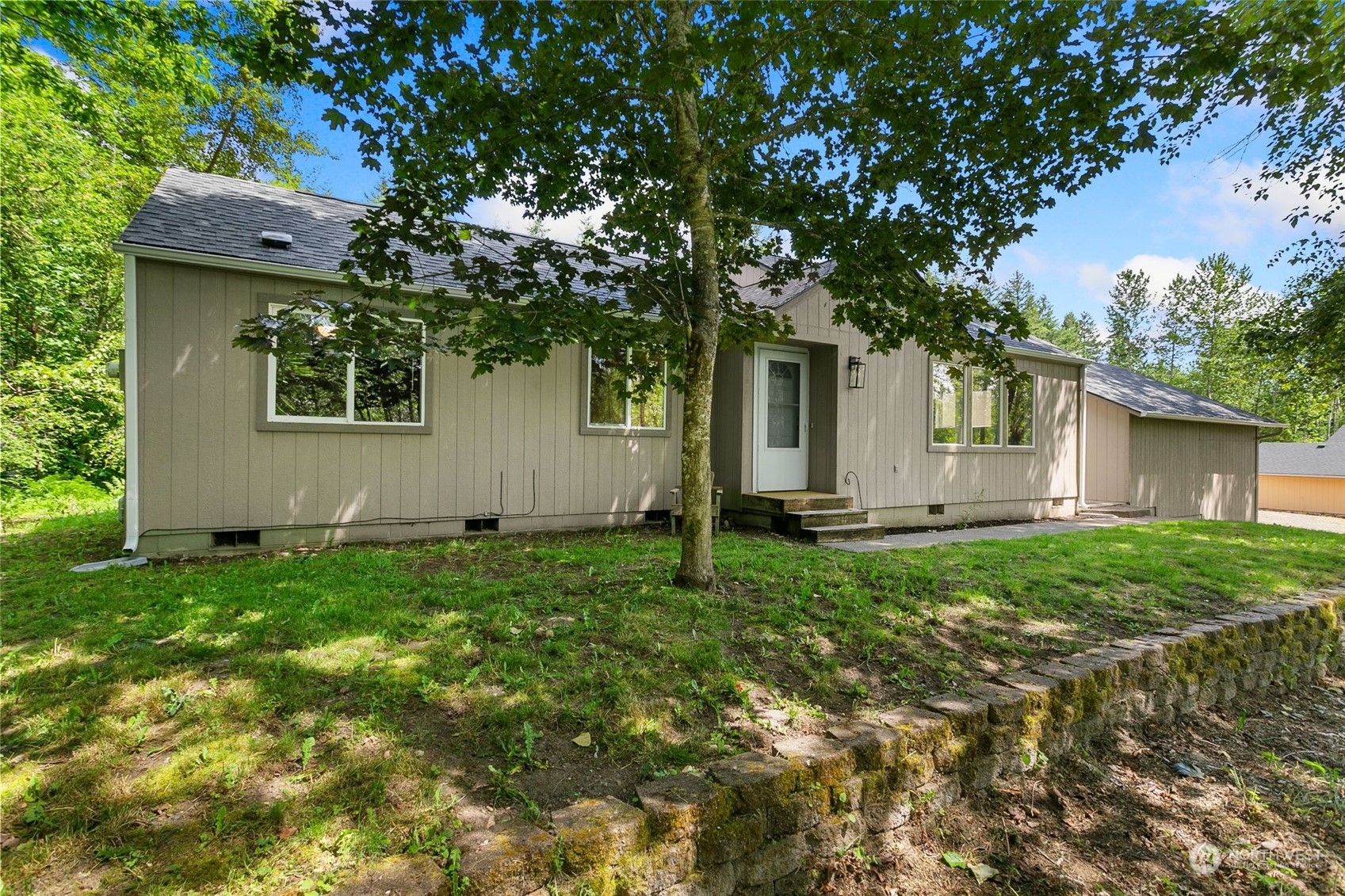a house view with a backyard space