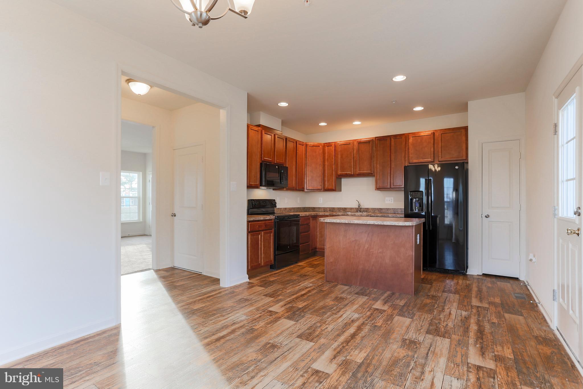 7 Back River Neck Road Baltimore, MD 21221 - Photo 25 of 29 a kitchen with stainless steel appliances granite countertop a refrigerator and a sink