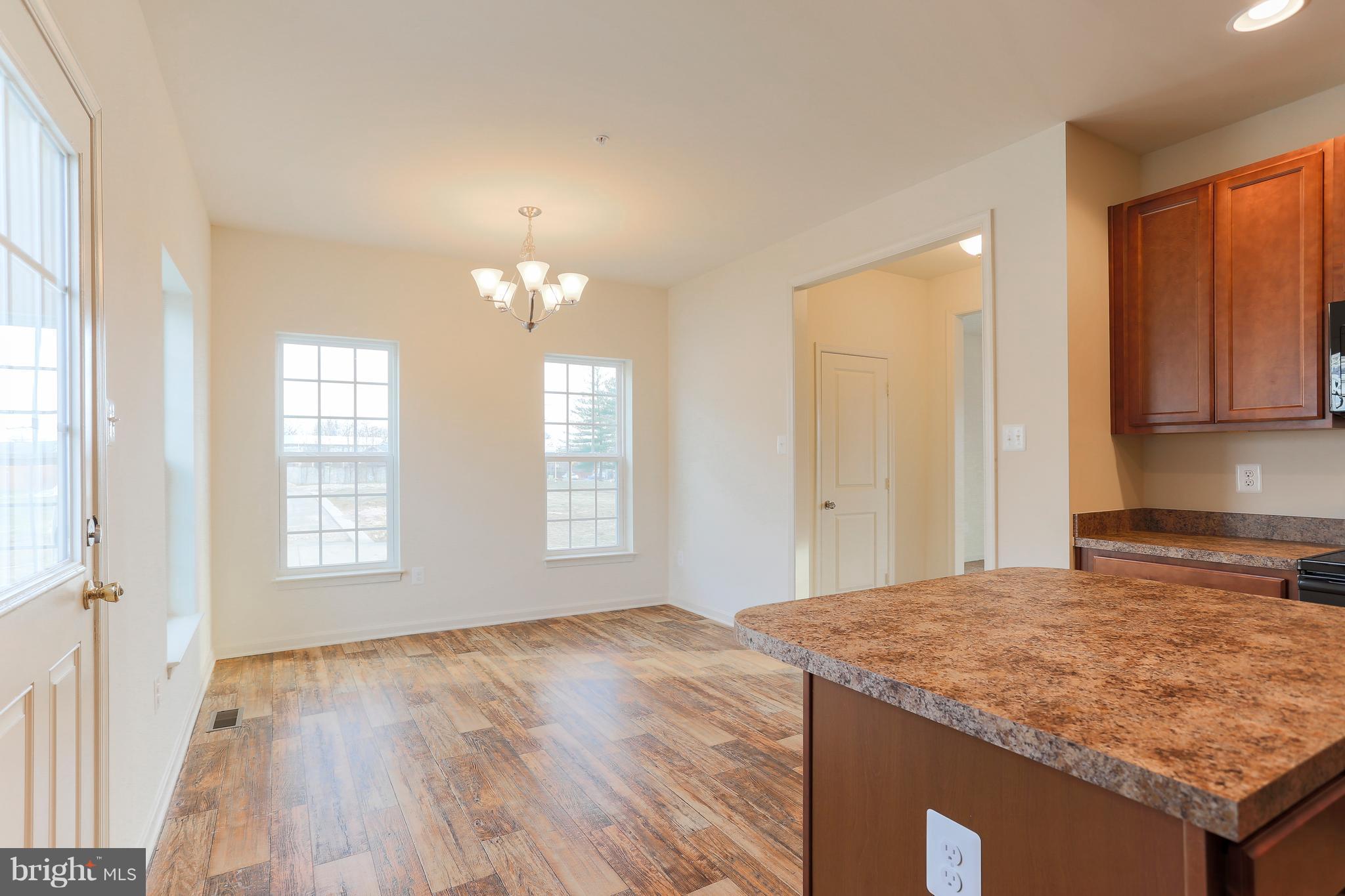 7 Back River Neck Road Baltimore, MD 21221 - Photo 28 of 29 a view of a kitchen cabinets and wooden floor