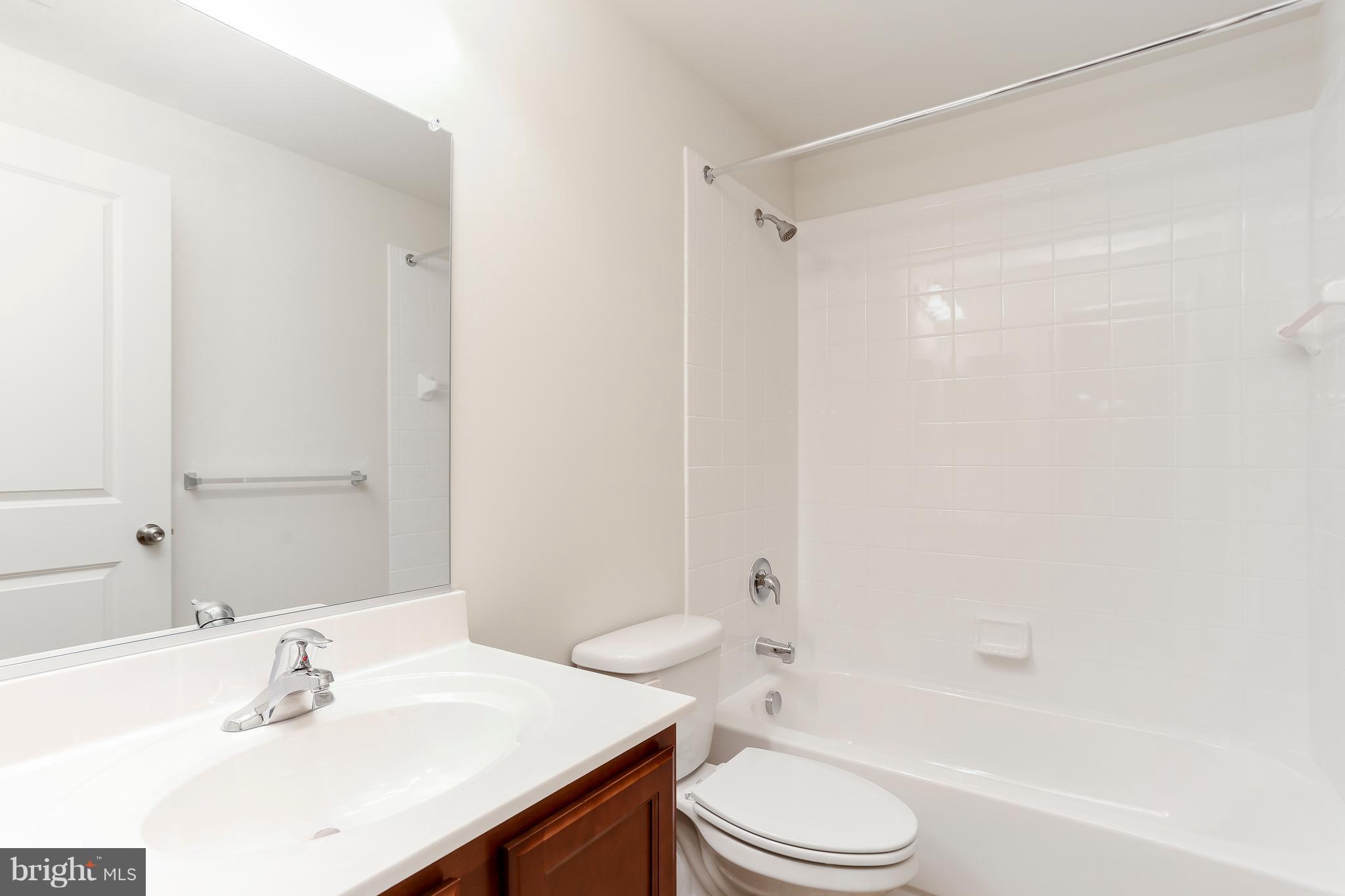 7 Back River Neck Road Baltimore, MD 21221 - Photo 8 of 29 a bathroom with a sink toilet and shower