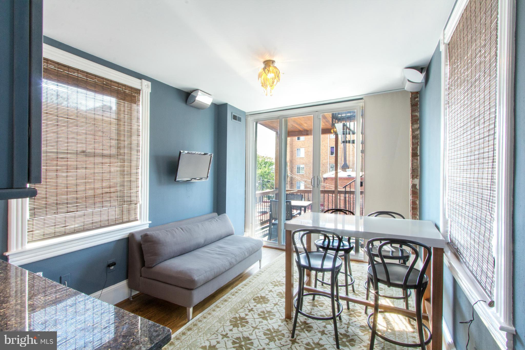 124 3rd Street Northeast Washington, DC 20002 - Photo 18 of 30 a living room with furniture and a window