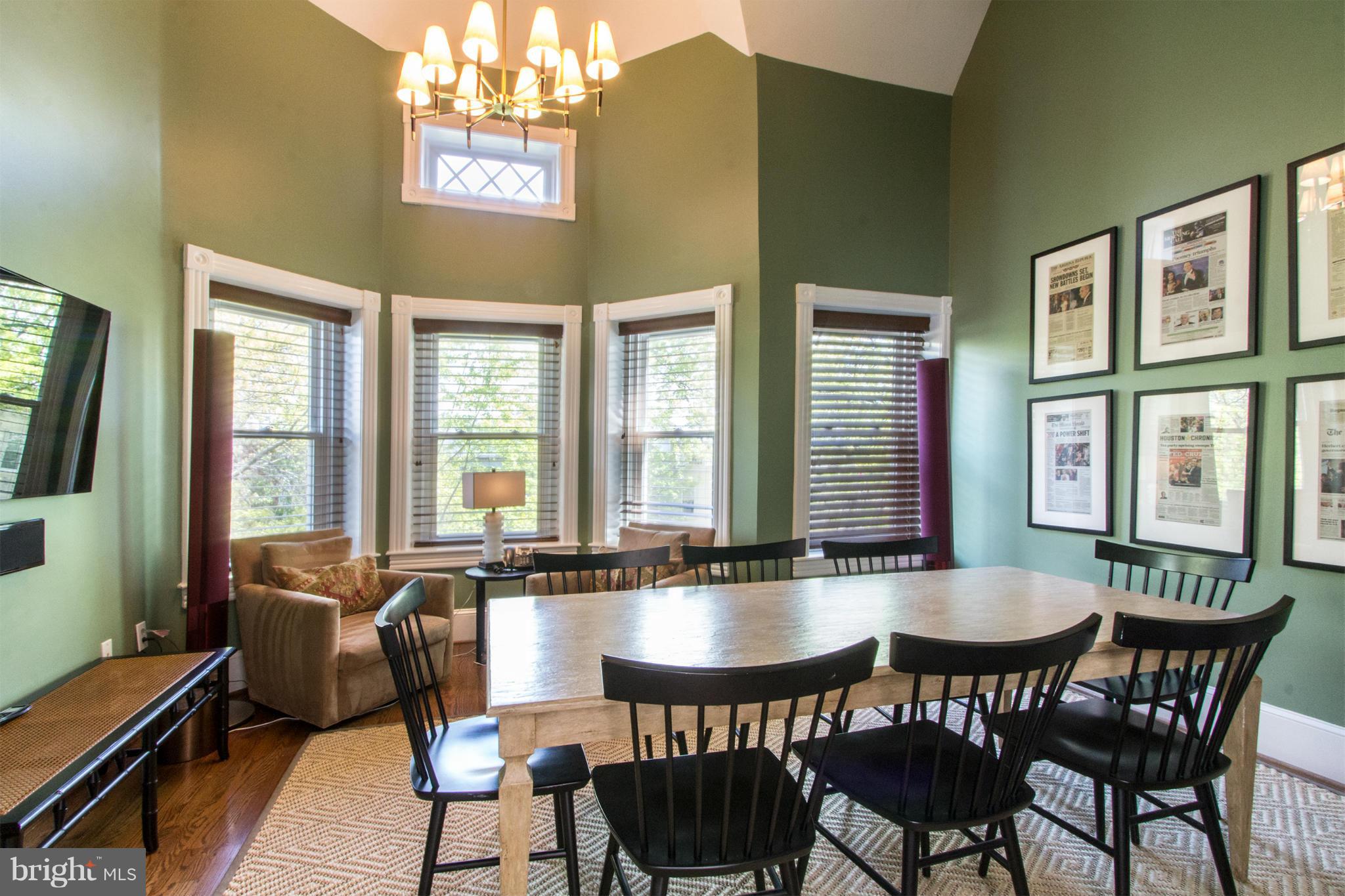 124 3rd Street Northeast Washington, DC 20002 - Photo 19 of 30 a dining room with furniture a chandelier and window