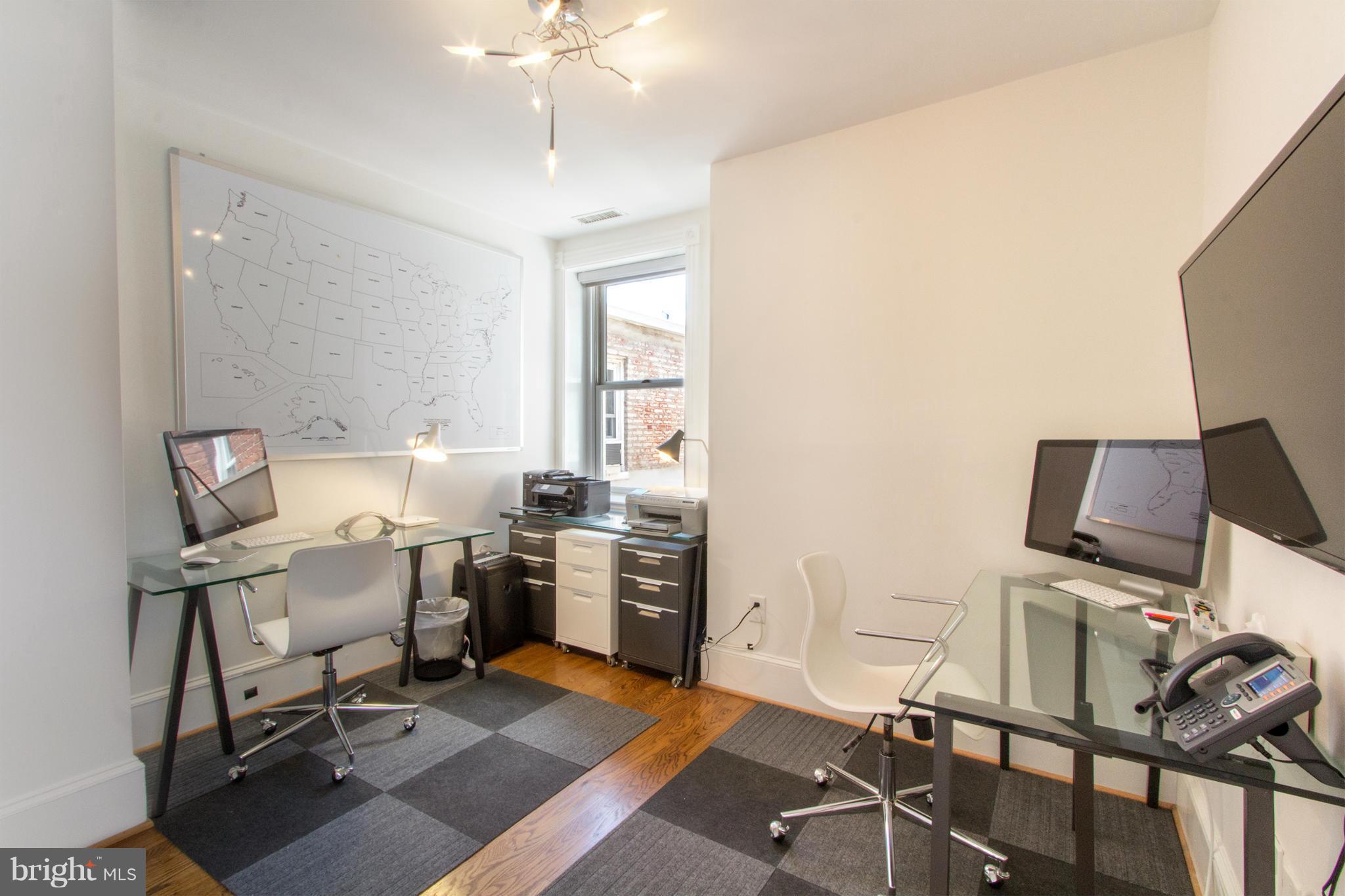 124 3rd Street Northeast Washington, DC 20002 - Photo 20 of 30 a view of a workspace with furniture and a window