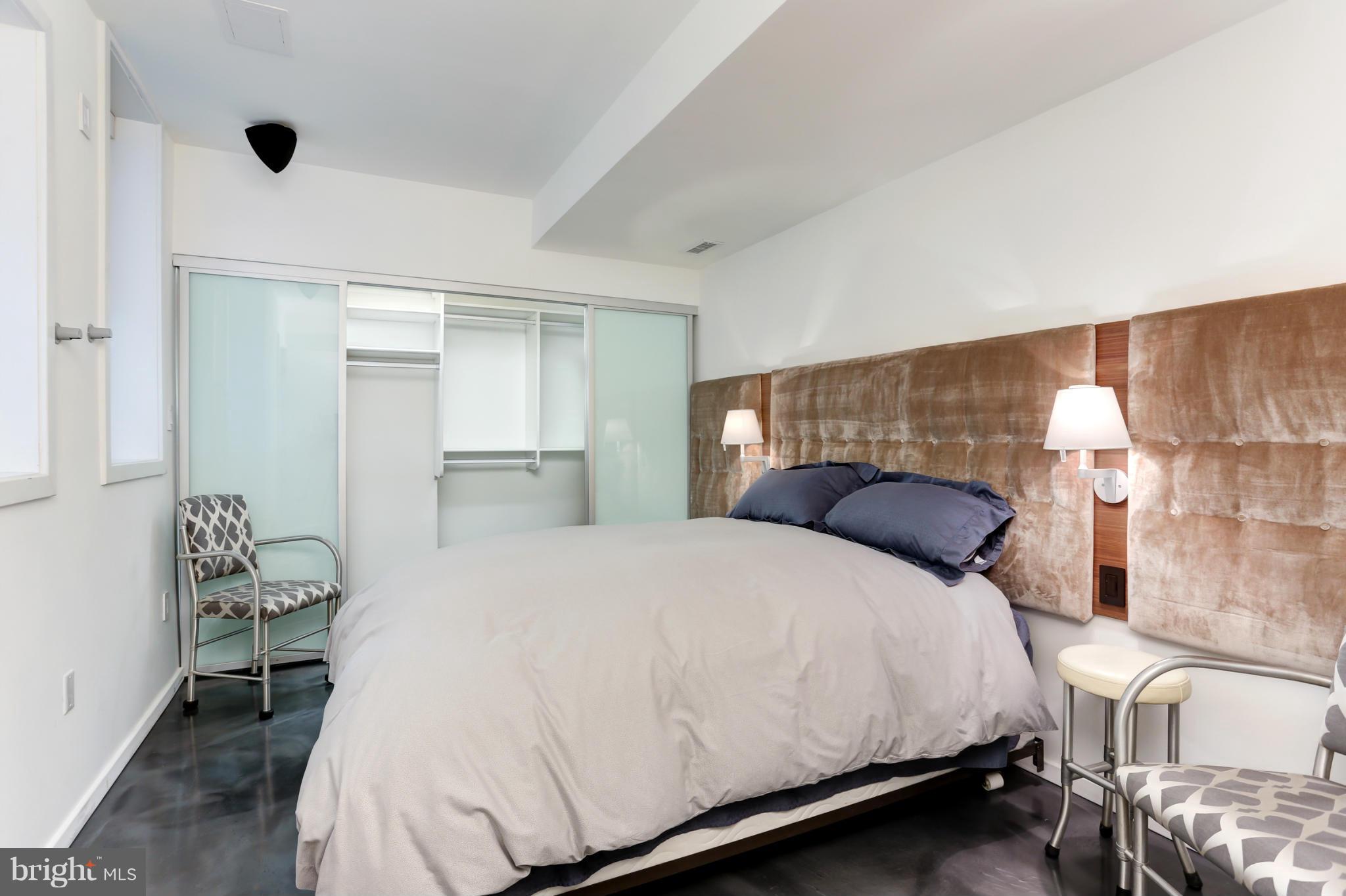 124 3rd Street Northeast Washington, DC 20002 - Photo 27 of 30 a large white bed in a white room