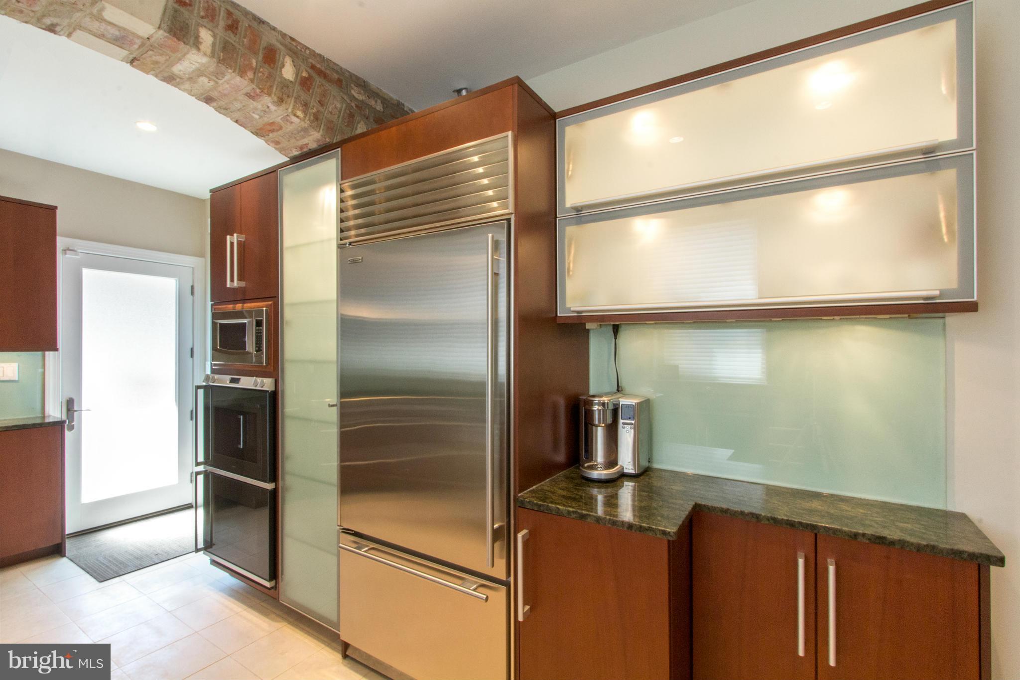 124 3rd Street Northeast Washington, DC 20002 - Photo 10 of 30 a kitchen with a refrigerator and a sink