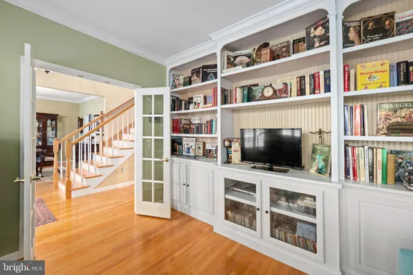 a living room with fireplace furniture and a flat screen tv