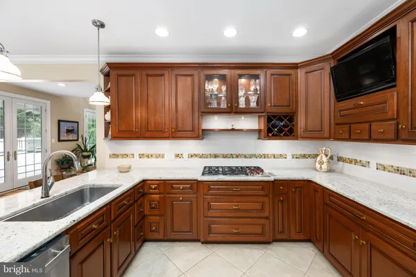 a view of a dining room with furniture and a chandelier