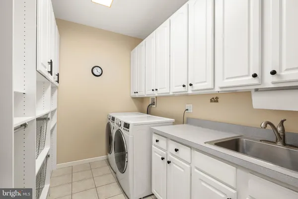a bedroom with a bed wooden floor and window