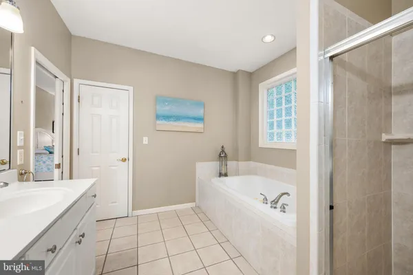 a bathroom with a sink a toilet and vanity