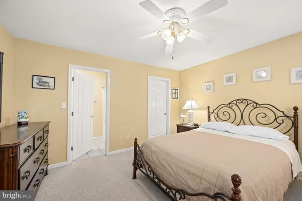 a balcony with furniture and a potted plant