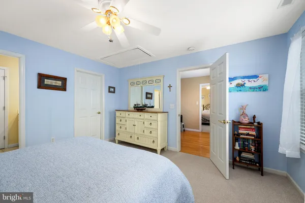 a view of a house with backyard and porch
