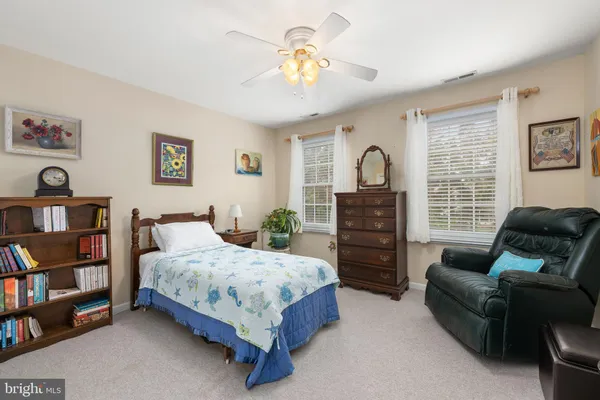 a view of front door with porch and wooden floor