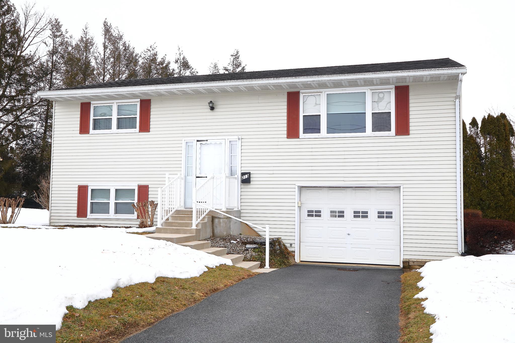 Charming split-level home with inviting curb ap...