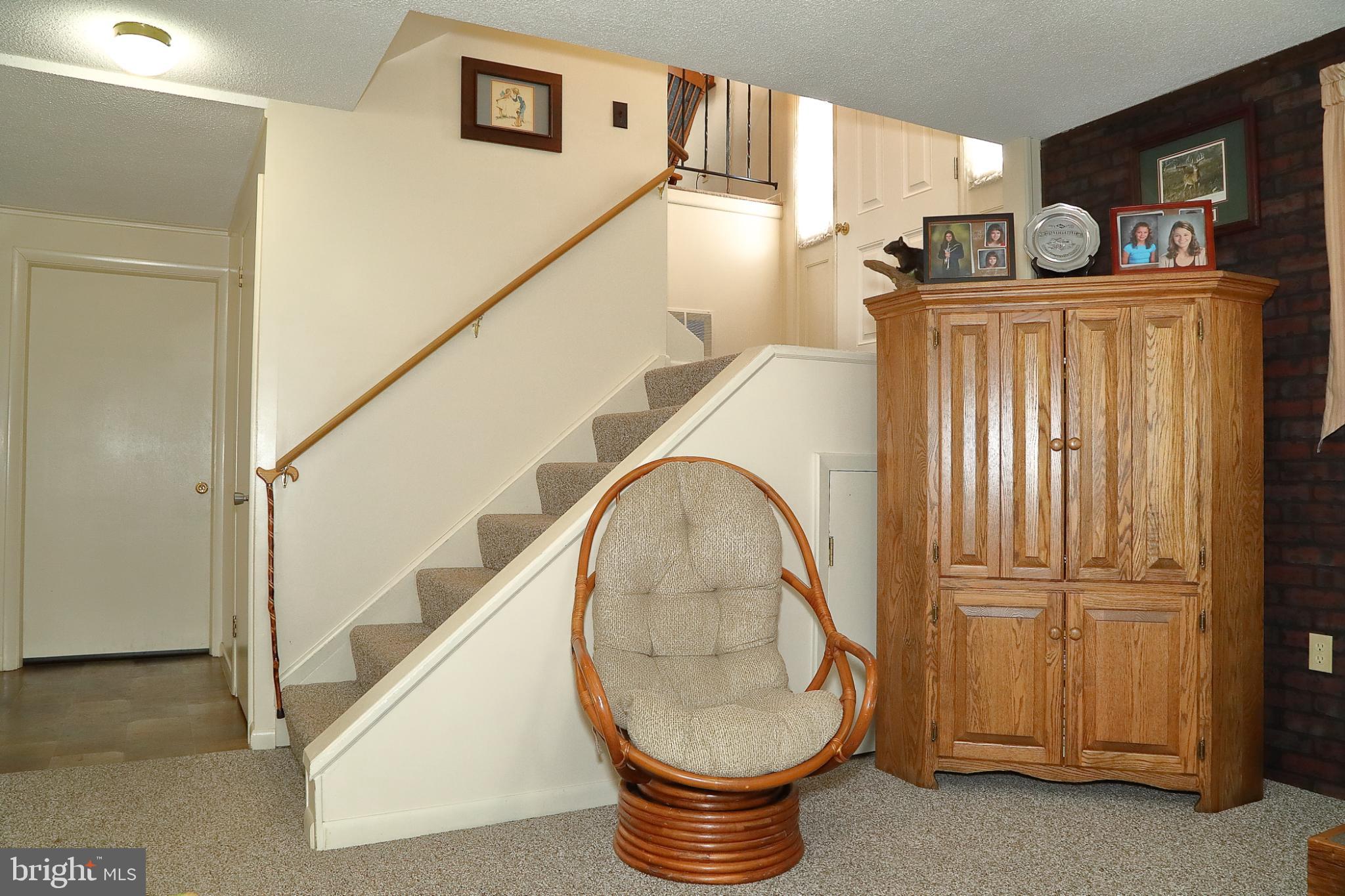 213 North Locust Street Lititz, PA 17543 - Photo 19 of 22 Inviting entryway with charming staircase.