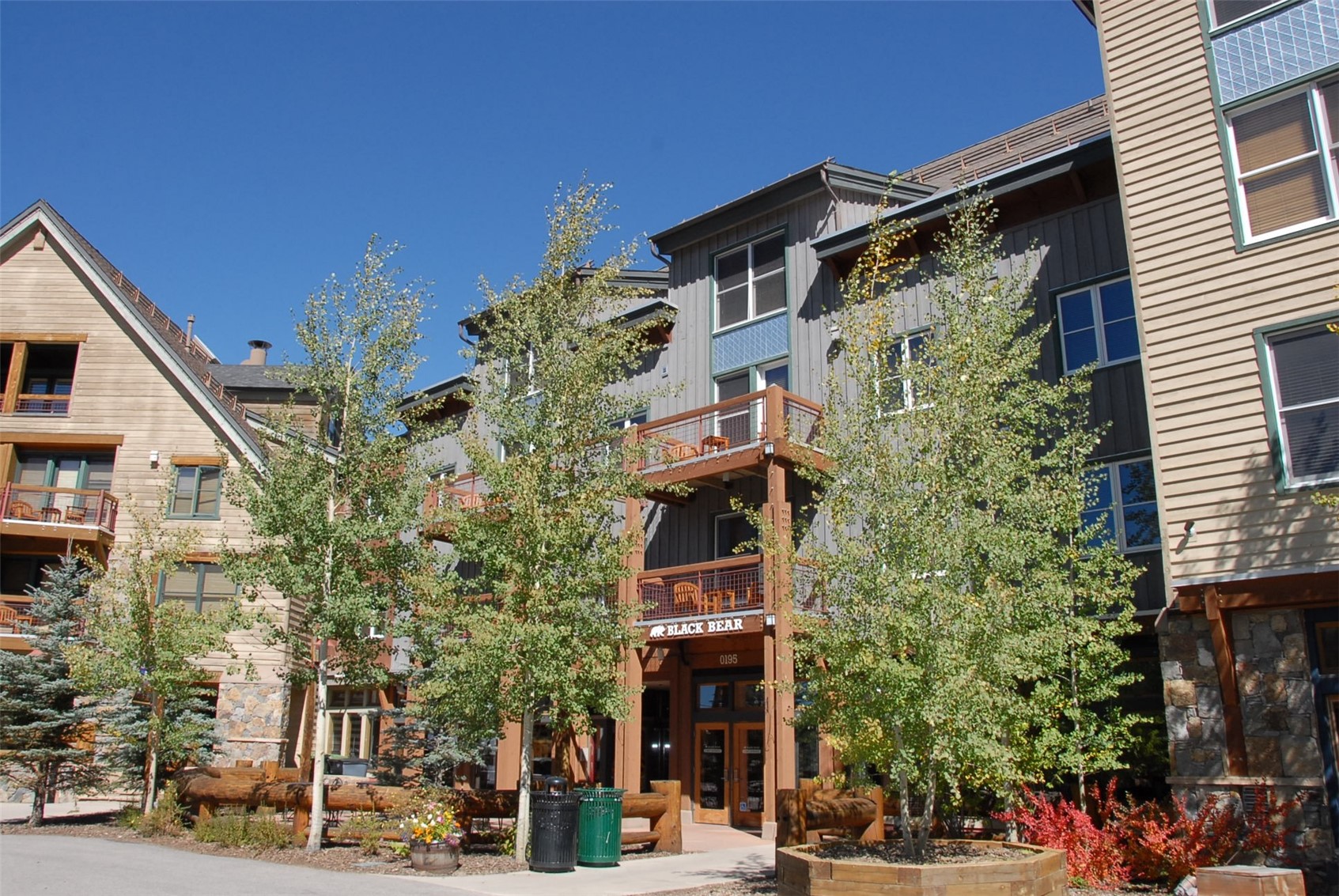 129 River Run Road, Unit 8051 Keystone, CO 80435 - Photo 27 of 50 Multi-story exterior with wood siding, stone accents, and multiple balconies