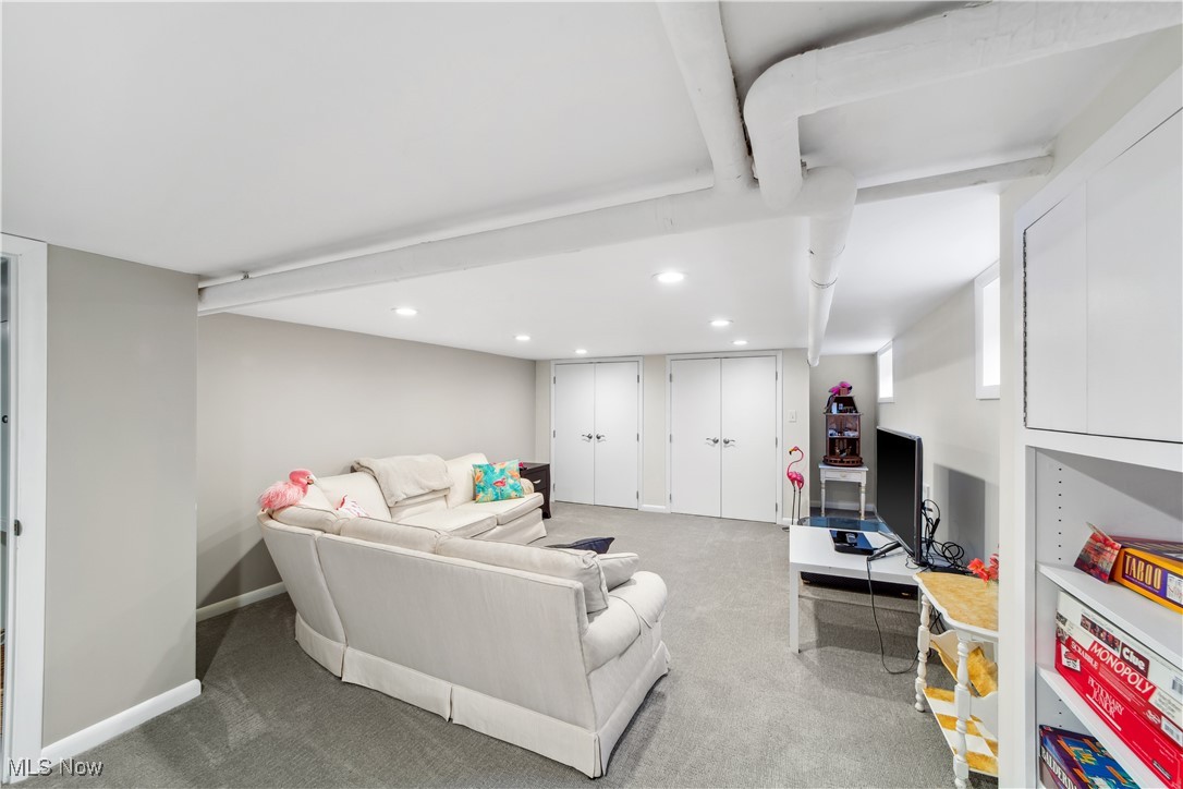 17027 Fernway Road Cleveland, OH 44120 - Photo 31 of 42 Carpeted living area with recessed lighting and baseboards