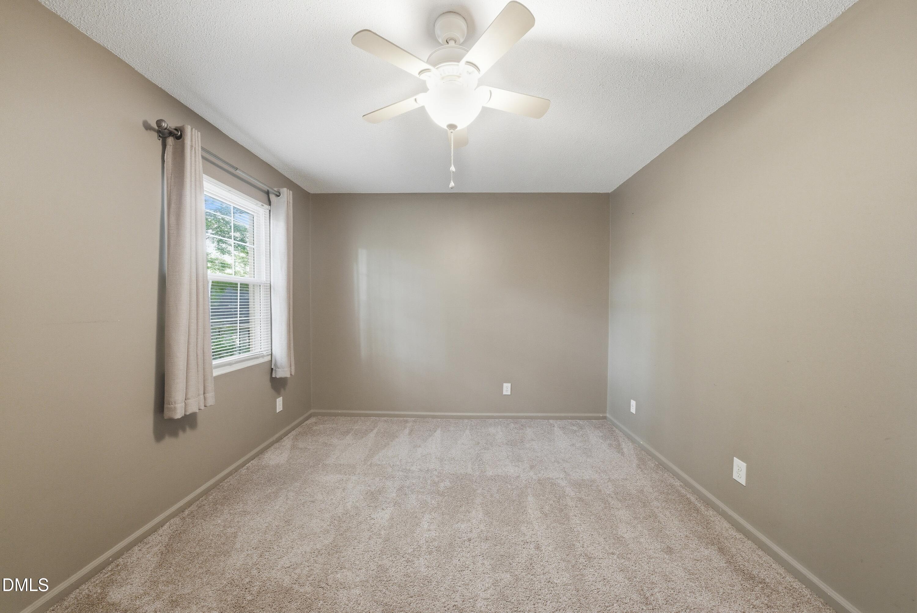 6355 New Market Way Raleigh, NC 27615 - Photo 23 of 30 wooden floor in an empty room with a window
