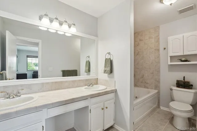 a bathroom with a sink a toilet and a bathtub