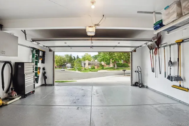 a storage room with water heater and a window