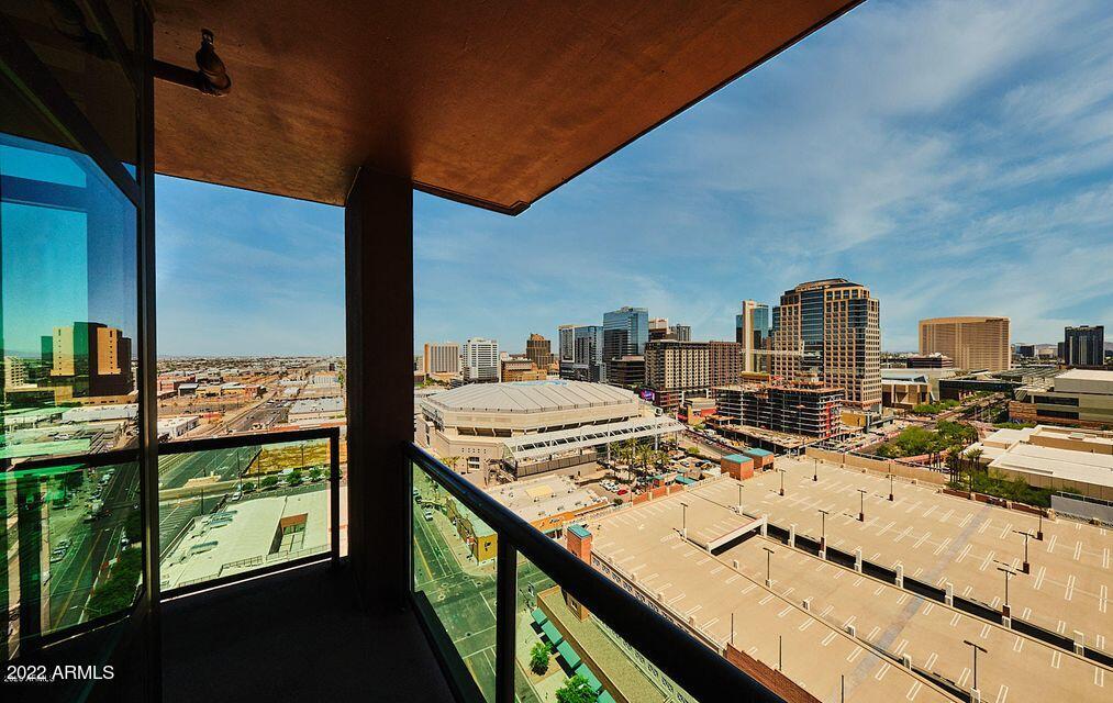 310 South 4th Street, Unit 605 Phoenix, AZ 85004 - Photo 15 of 26 a view of a balcony dining table and chairs
