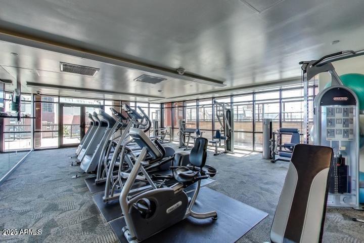 310 South 4th Street, Unit 605 Phoenix, AZ 85004 - Photo 5 of 26 a view of a room with gym equipment