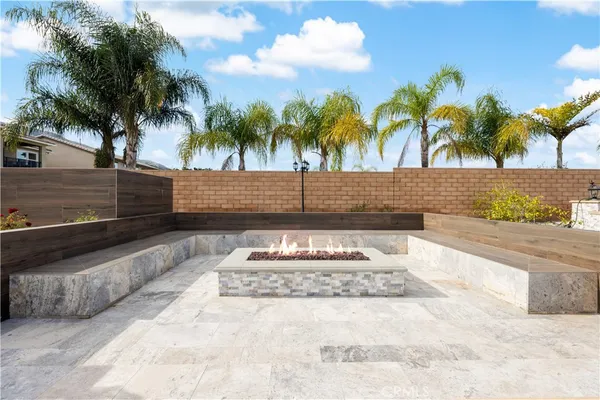 a swimming pool with outdoor seating and yard