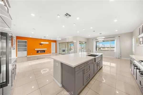 a kitchen with a sink and a refrigerator