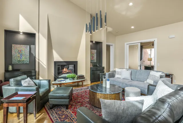 a kitchen with stainless steel appliances granite countertop a sink and a refrigerator