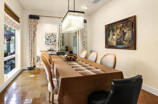 a view of a house with swimming pool and sitting area