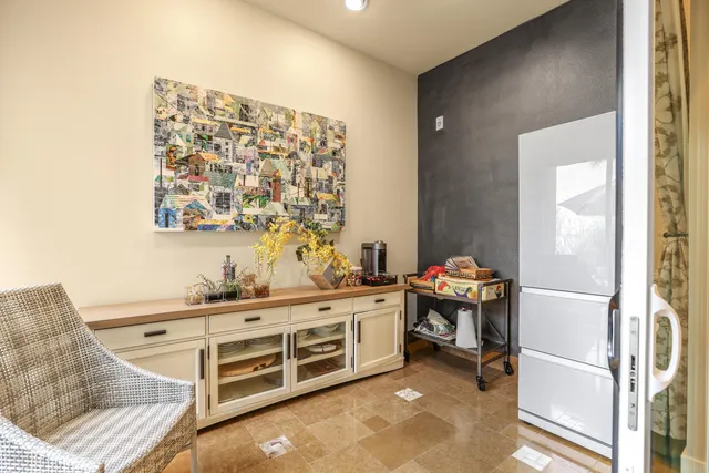 a bedroom with a bed window and a flat screen tv