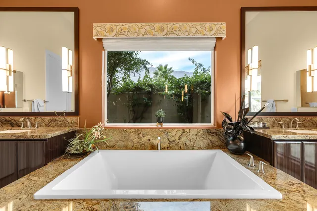 a view of a patio with swimming pool table and chairs