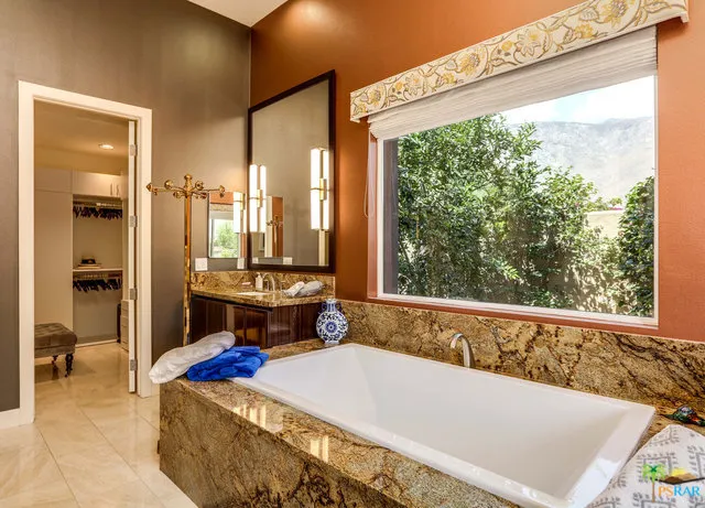 a view of a house with swimming pool patio and garden