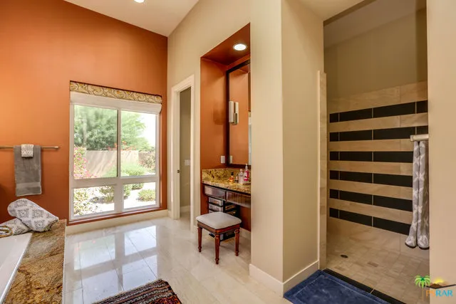 a view of swimming pool with a table and chairs