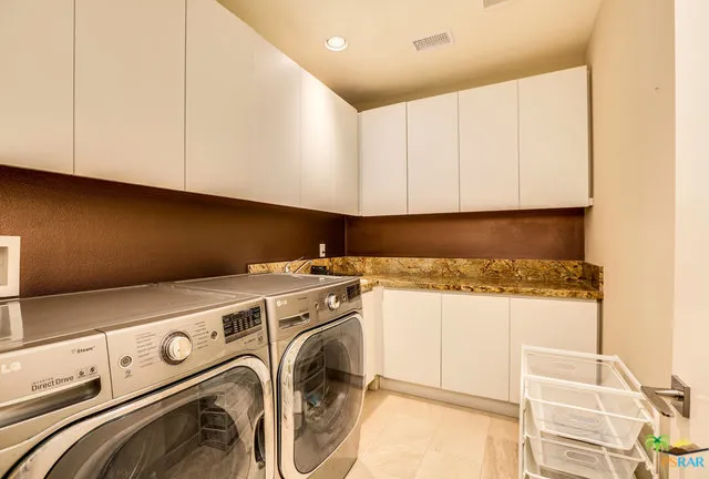 a view of swimming pool with outdoor seating and city view