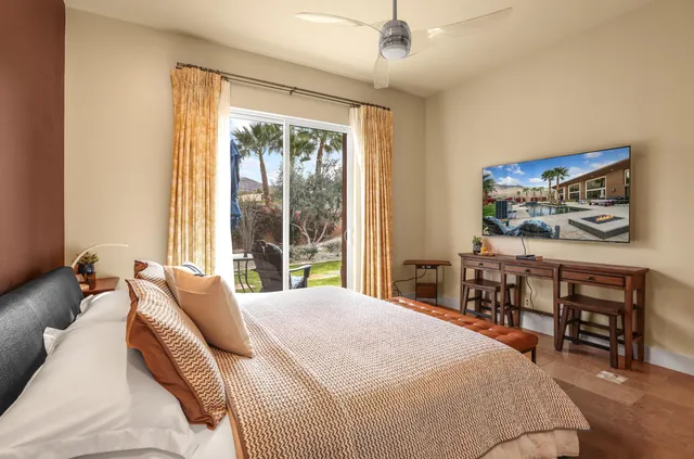 a view of a hallway with workspace and living room view