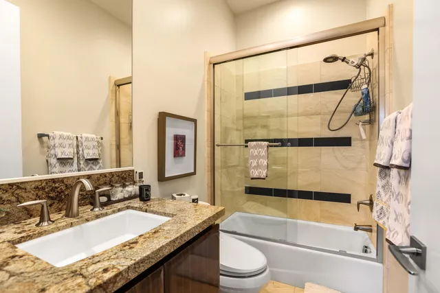 a view of a swimming pool with chairs